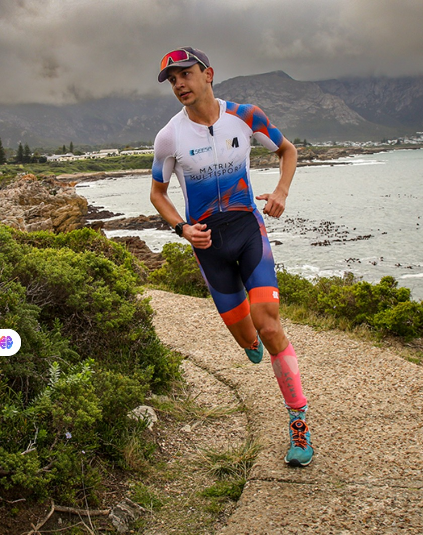 Matrix athlete running along the South African coast